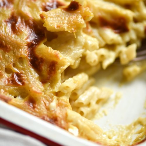 Vegan, gluten free mac and cheese in a white baking dish