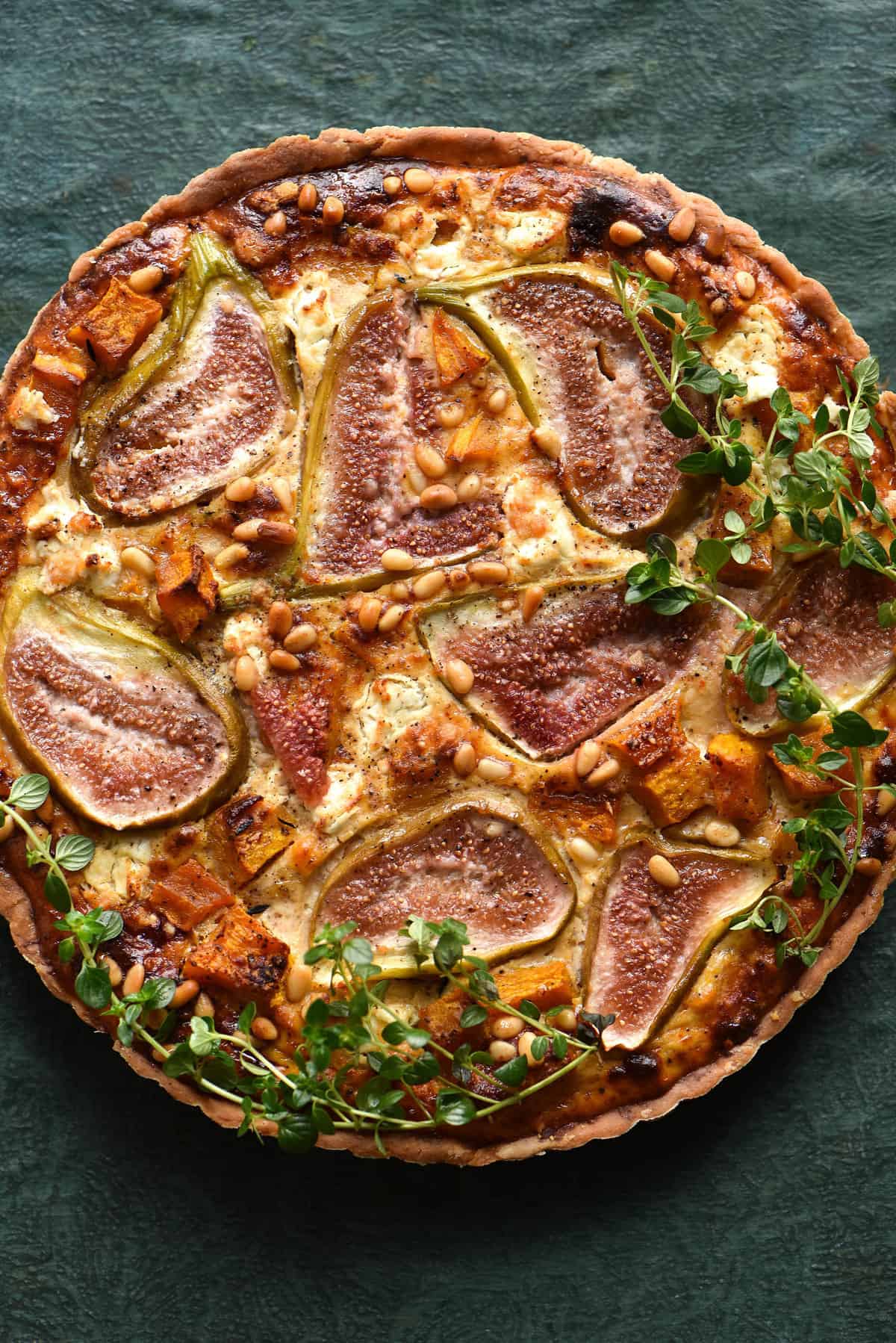 Savoury fig tart with roasted pumpkin, goats cheese and herbs, all encompassed in a gluten free/grain free or nut free pastry. Recipe from www.georgeats.com