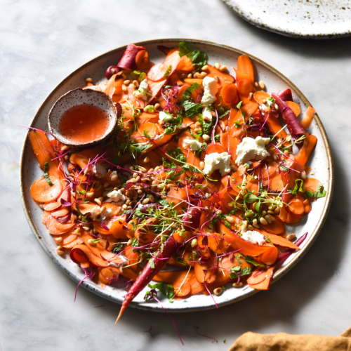 Shaved carrot salad with goat's cheese, toasted pine nuts, mint and an orange blossom, lemon and Campari dressing from www.georgeats.com. Gluten free, FODMAP friendly and vegetarian.