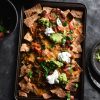 Vegetarian nachos with 'mince' queso, guacamole and salsa. Gluten free and FODMAP friendly, from www.georgeats.com