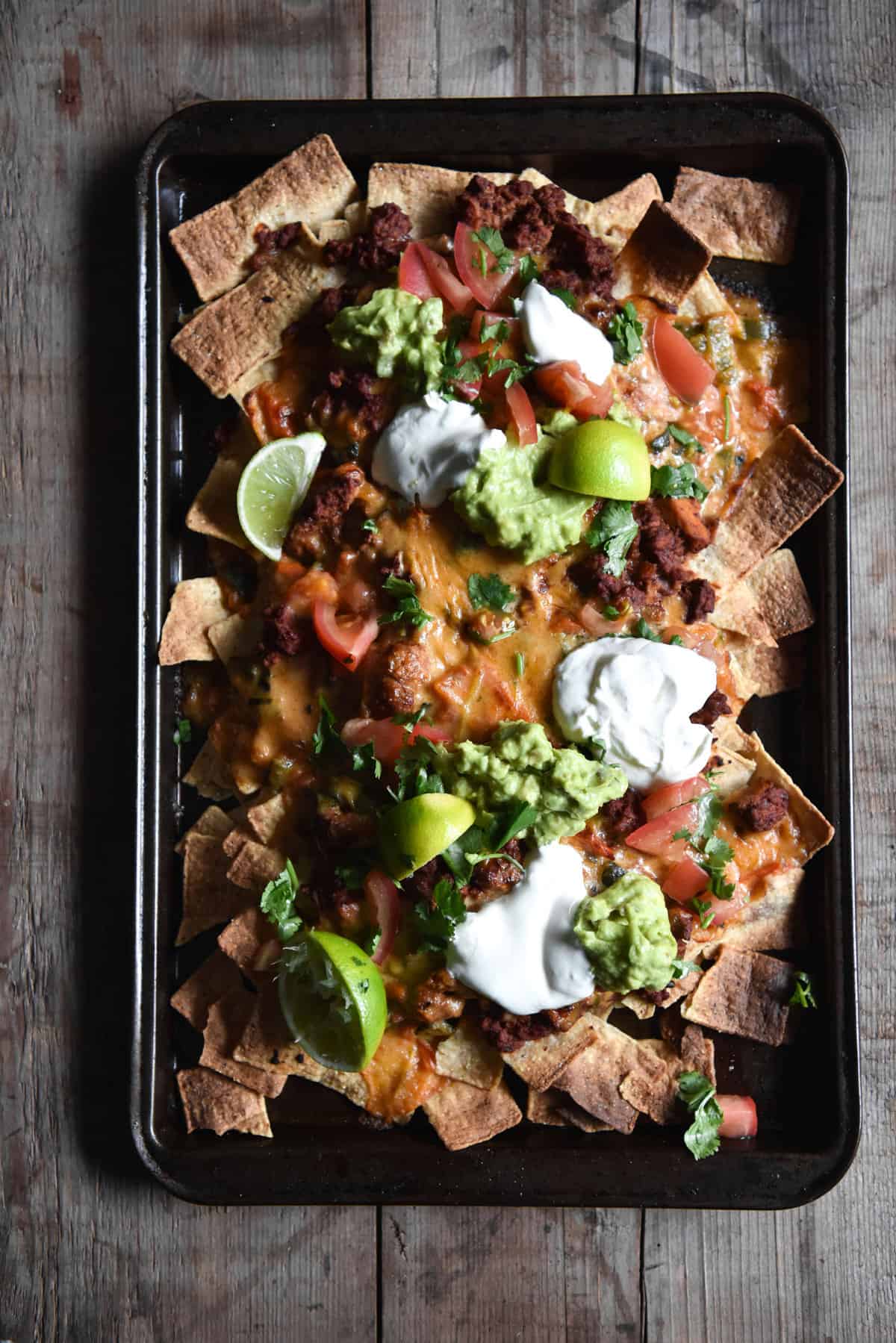 Vegetarian nachos with 'mince' queso, guacamole and salsa. Gluten free and FODMAP friendly, from www.georgeats.com