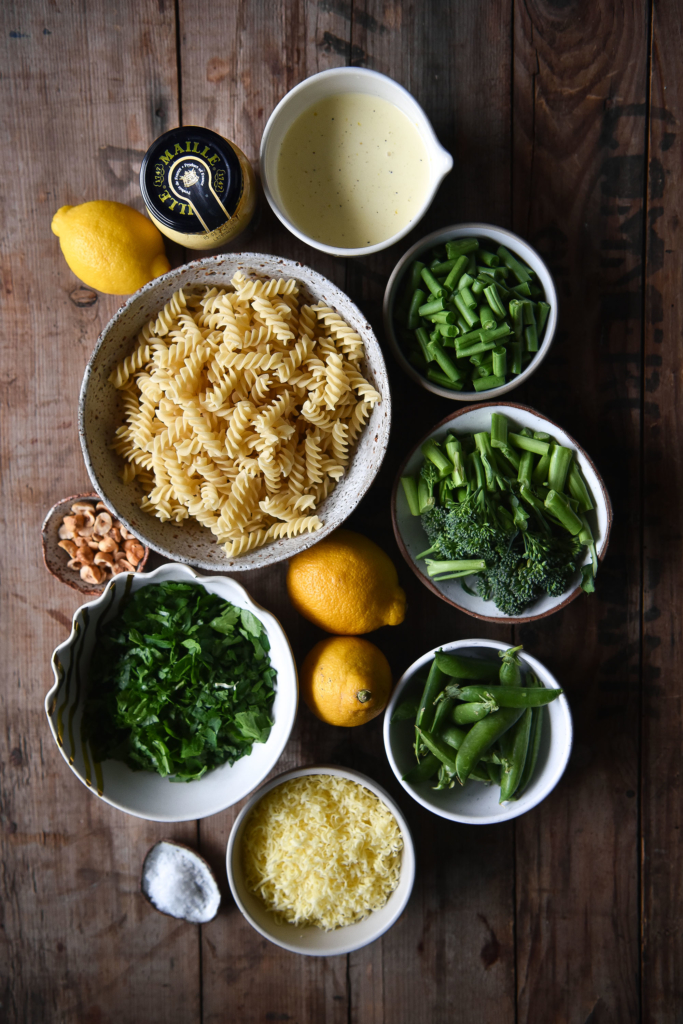 Creamy lemon and mustard pasta with greens and toasted hazelnuts. Gluten free, vegetarian and FODMAP friendly, from www.georgeats.com | @georgeats