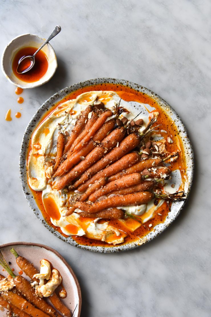 Dukkah roasted carrots with labne and aleppo chilli oil. Gluten free, FODMAP friendly and vegetarian. Recipe from www.georgeats.com | @georgeats