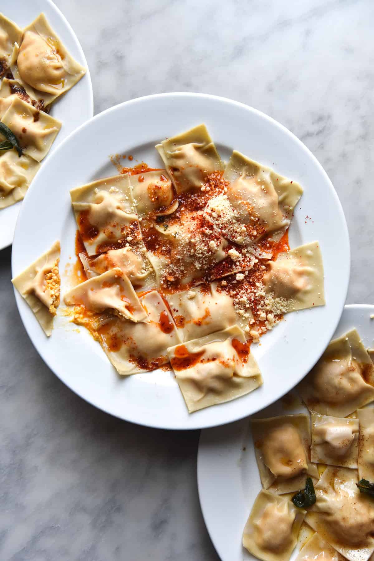 Homemade gluten free ravioli with lactose free ricotta and spinach filling and a brown butter crispy sage topping. FODMAP friendly, nut free, gluten free and vegetarian. Recipe from www.georgeats.com