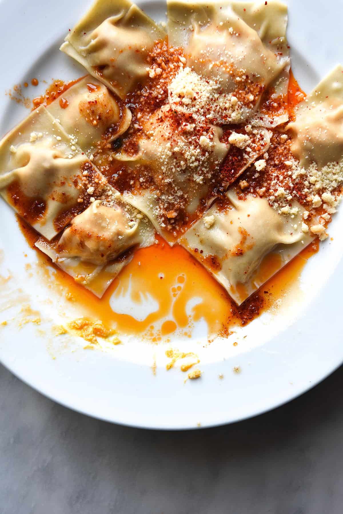 Homemade gluten free ravioli with lactose free ricotta and spinach filling and a brown butter crispy sage topping. FODMAP friendly, nut free, gluten free and vegetarian. Recipe from www.georgeats.com