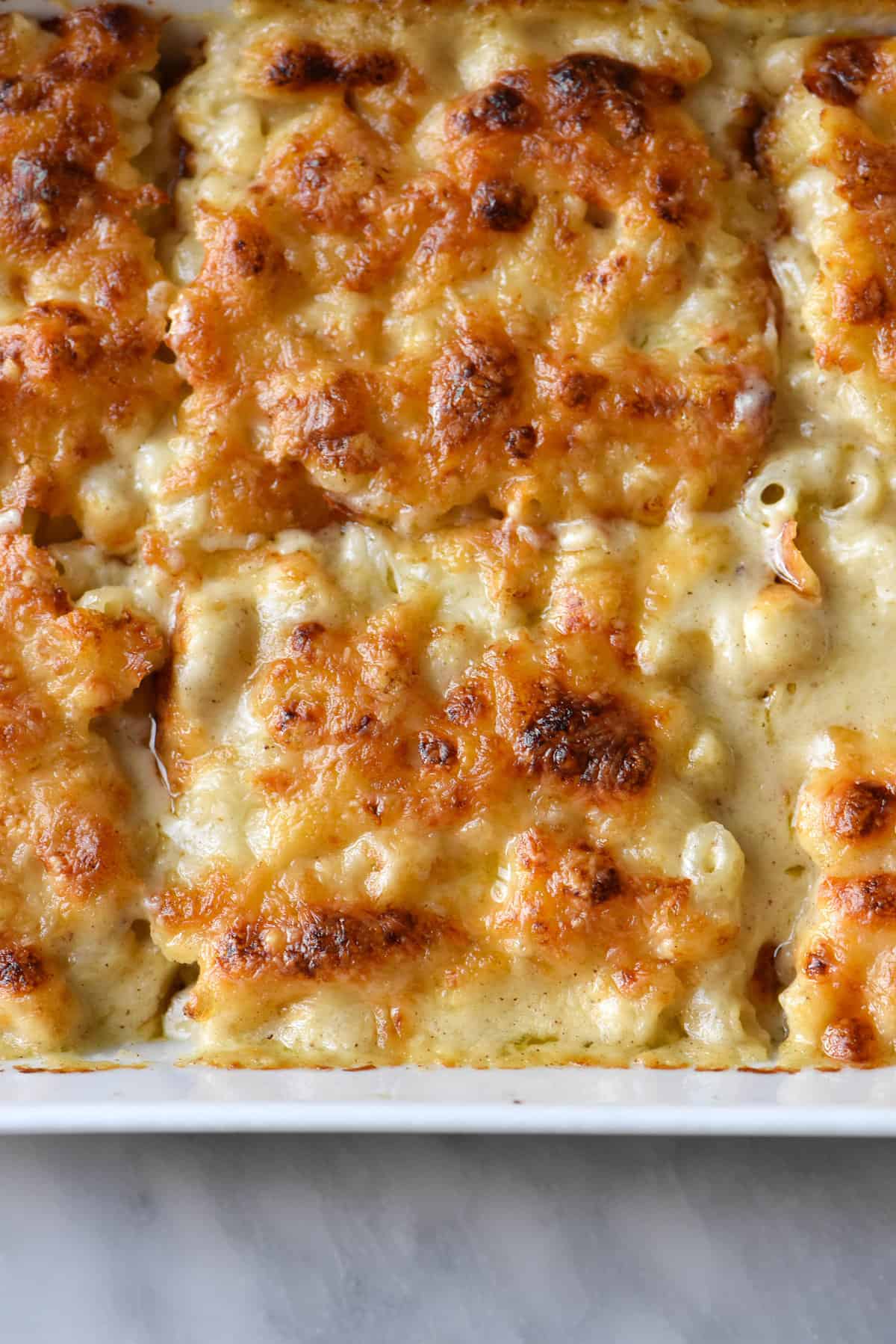 A close up of gluten free, FODMAP friendly mac and cheese bake