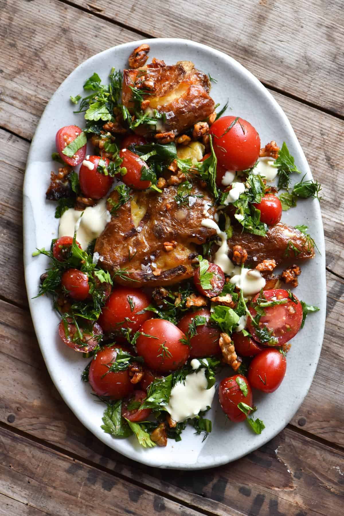 Crispy smashed potatoes with zingy sour cream, dill and smokey maple