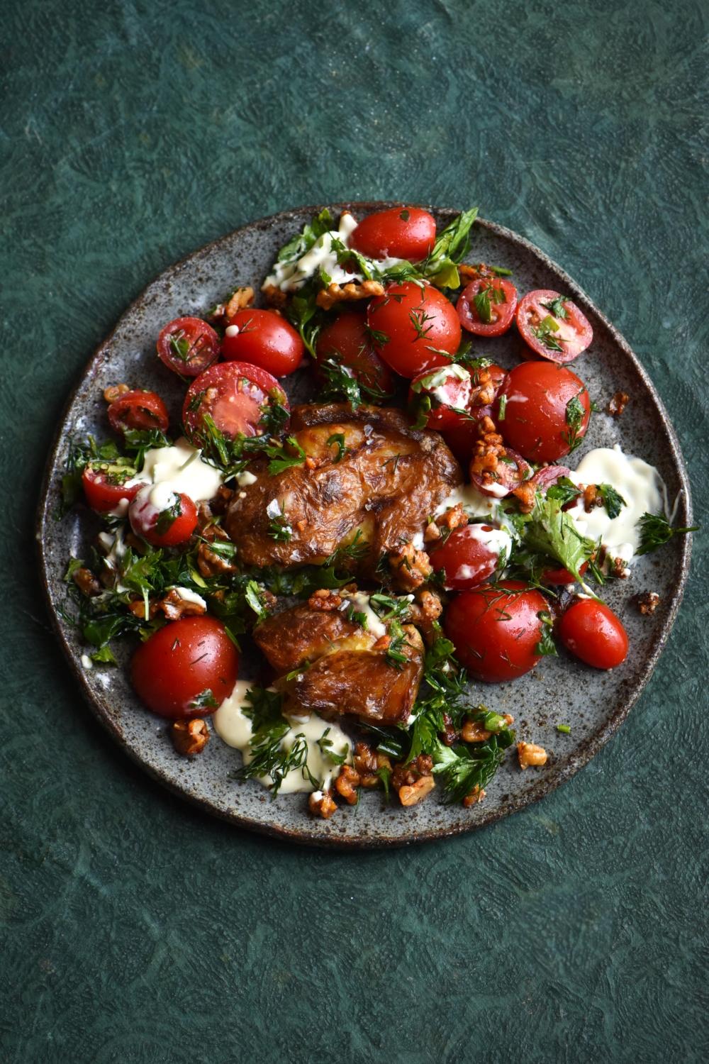 Crispy smashed potatoes with zingy sour cream, dill and smokey maple
