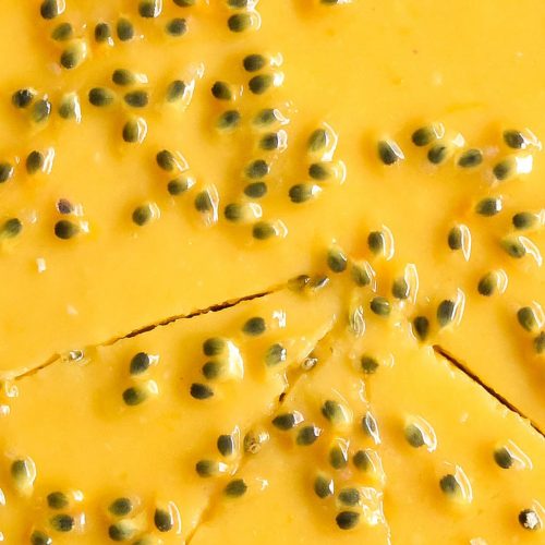 A close up macro image of a passionfruit curd tart