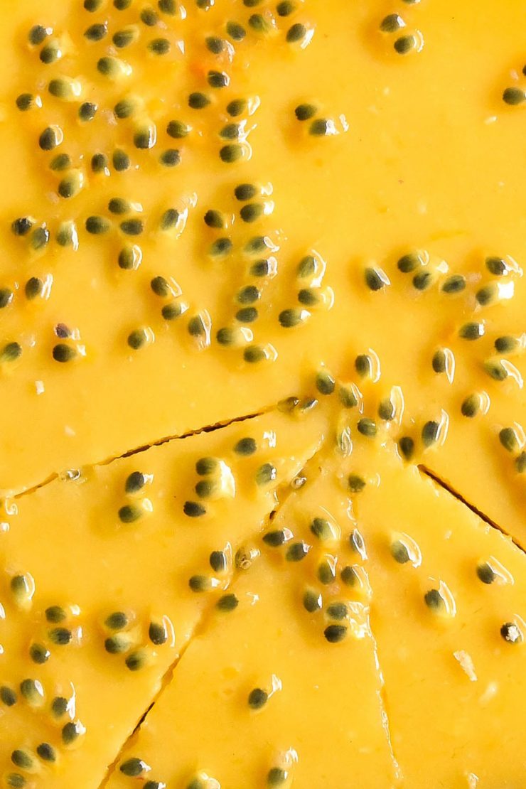 A close up macro image of a passionfruit curd tart