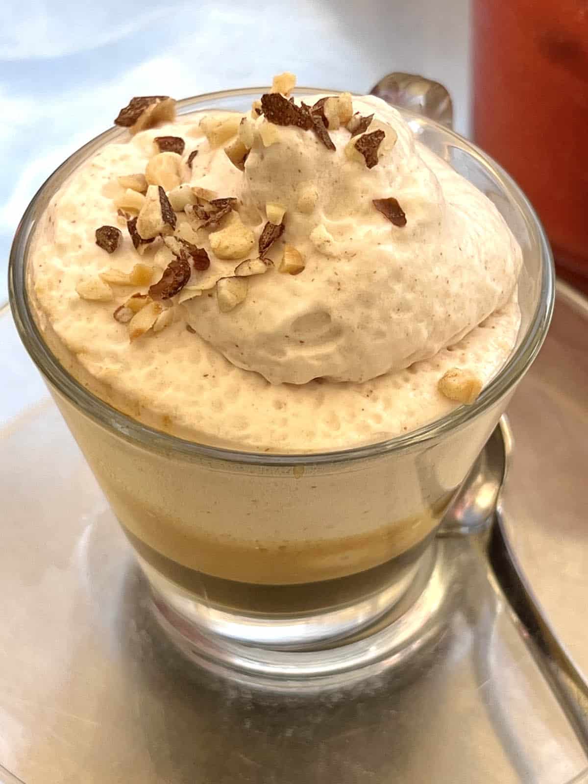 A close up image of an espresso topped with a whipped sweet almond cream from Caffè Sicilia in Noto, Sicily. 