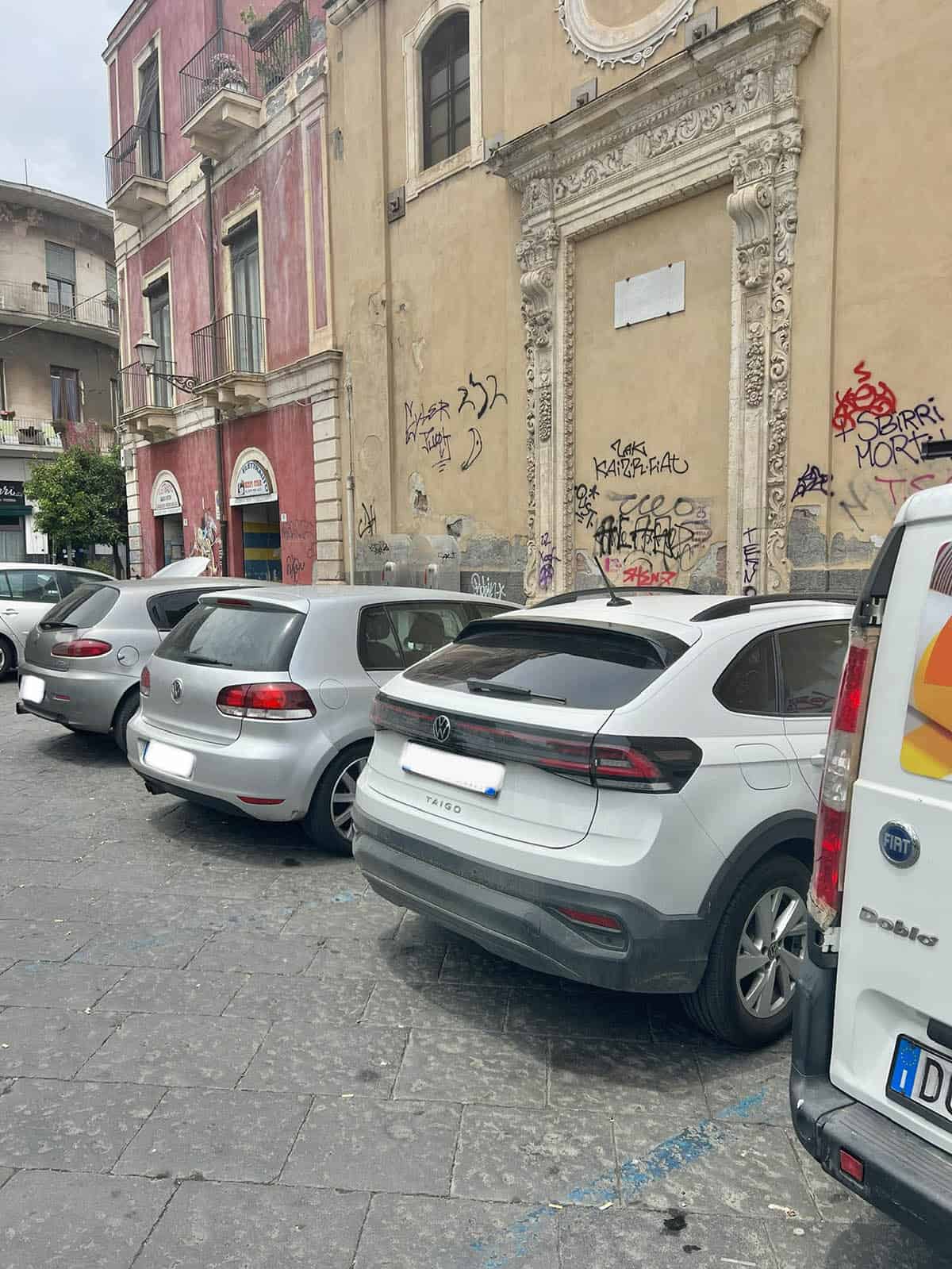 An image of cars parked in Sicily