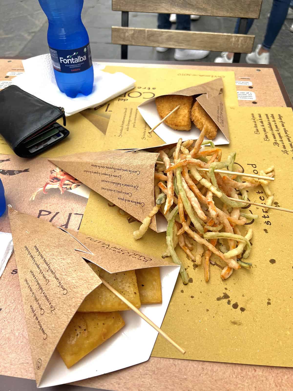 An image of Sicilian fried street food on a table in Noto Sicily. 