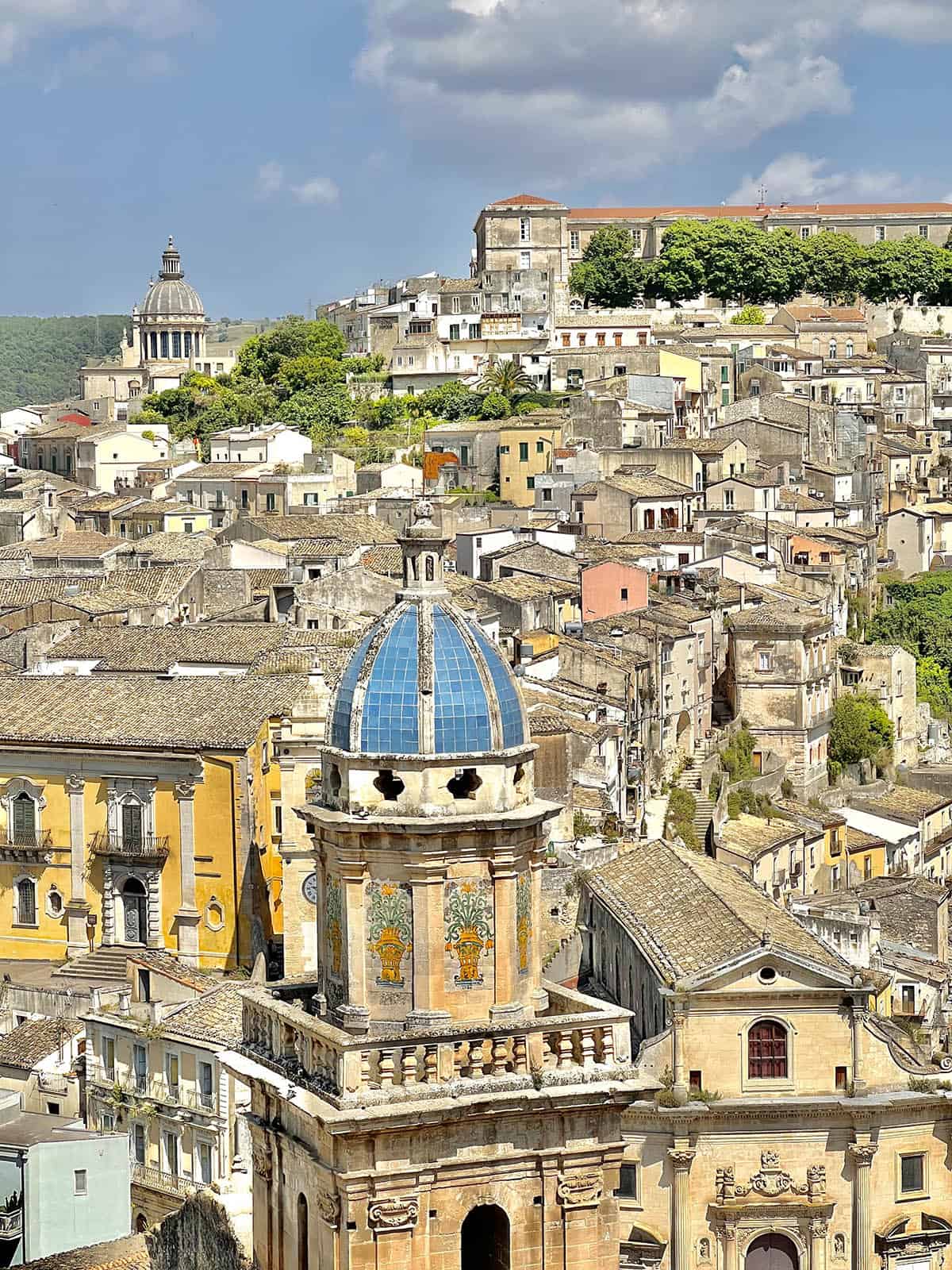An image of the beautiful skyline of Ragusa Ibla, as seen from Ragusa Superior. The image is taken on a bright sunny day. 