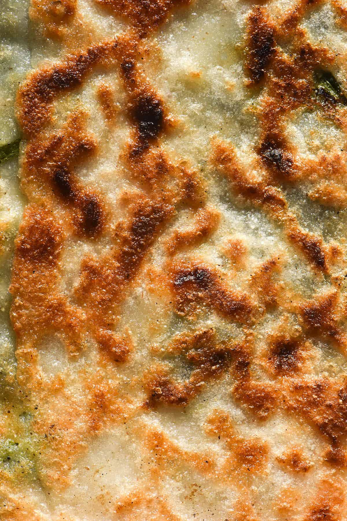 A macro close up image of a golden brown gluten free gozleme