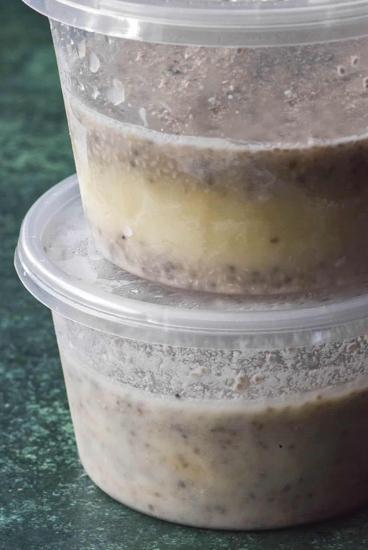 An instructional image demonstrating the benefit of adding yoghurt to chia pudding. Two tubs of frozen chia pudding sit in a stack to demonstrate how yoghurt prevents separation of chia and dairy.