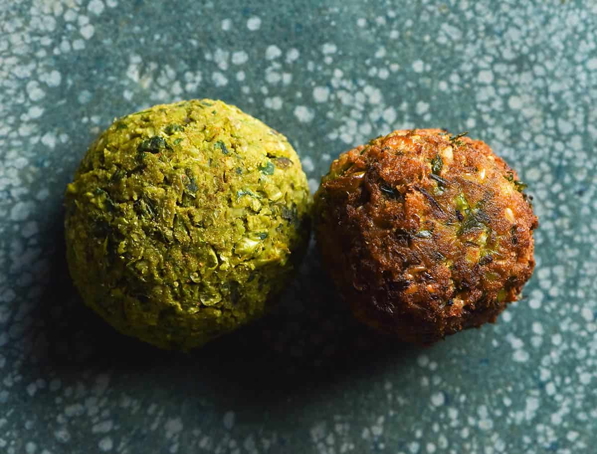 A comparison image of a baked falafel and a fried falafel. The baked version is a bright green and the fried version has that classic golden brown crust.