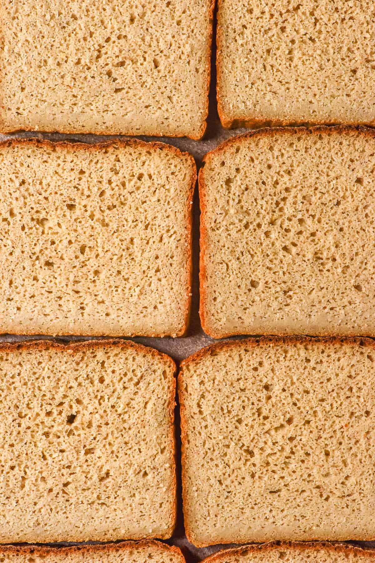 An aerial image of slices of quinoa bread arranged on a table