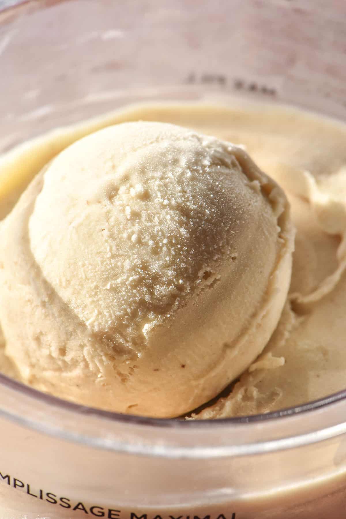 A brightly lit close up image of a scoop of Ninja Creami banana ice cream