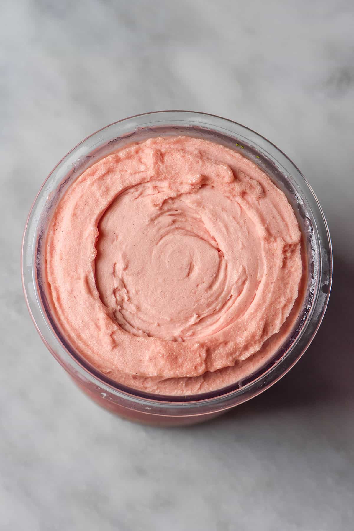 An aerial image of a tub of fresh spun watermelon Ninja Creami sorbet