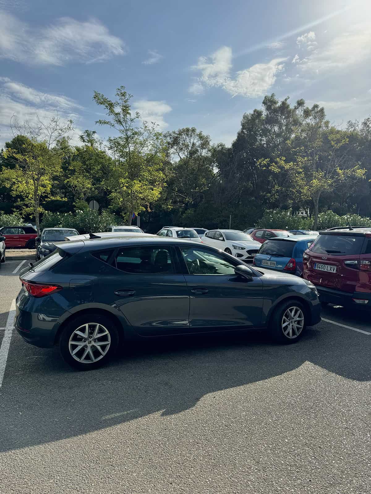 An image of a small car parked in a car park in Mallorca