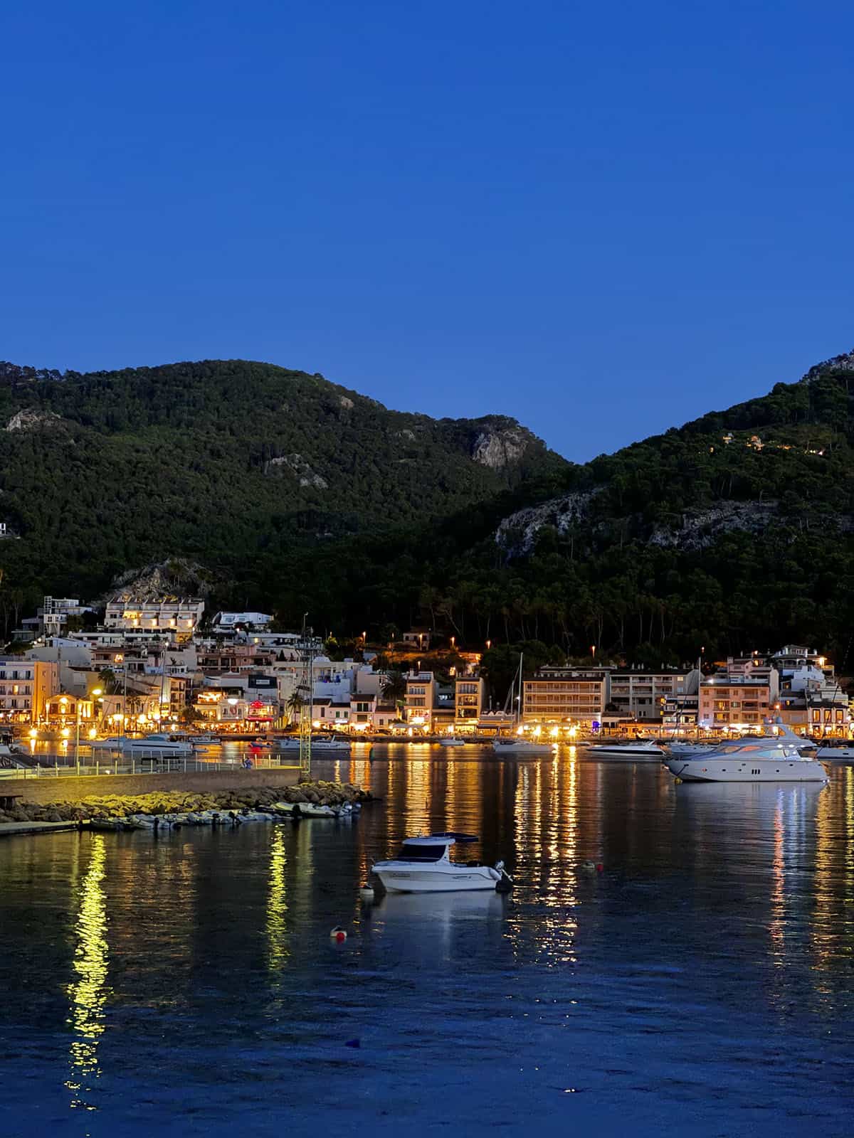 A view of Port D'Andratx harbour and town at nightfall