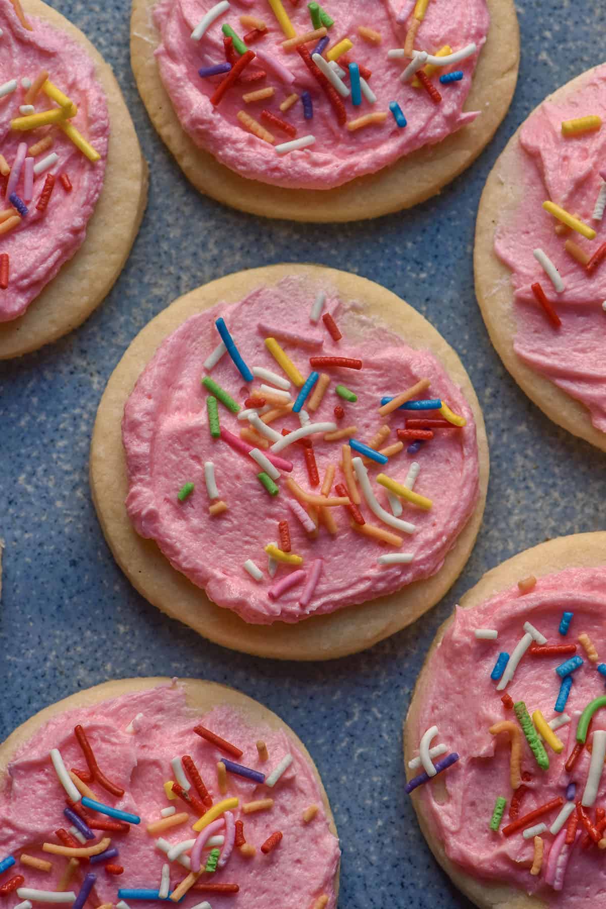 An aerial image of gluten free Lofthouse cookies on a blue ceramic plate