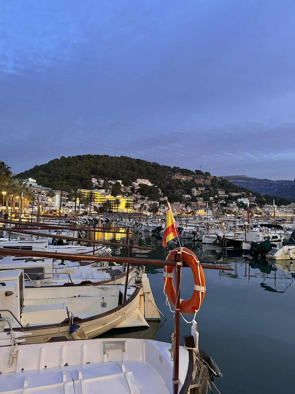 An image of the boats in Port De Soller harbour at sunset