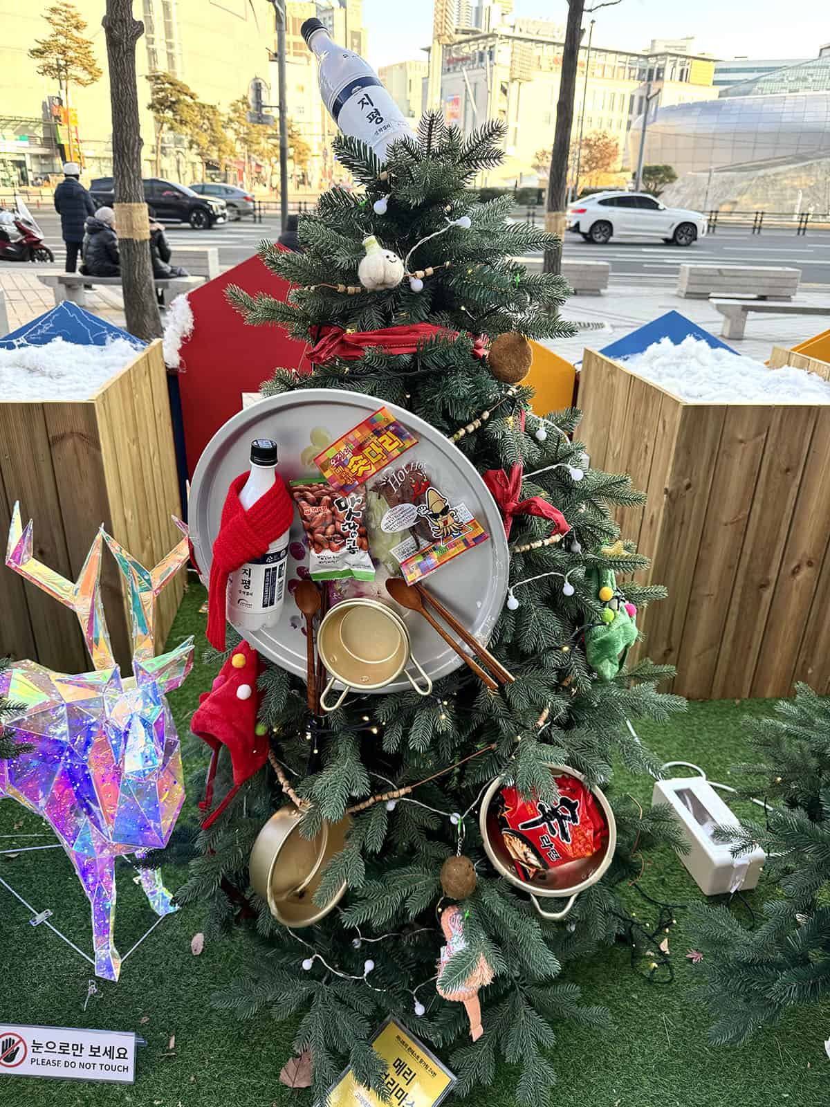 A Christmas tree decorated with typically Korean foods like soju and noodles 