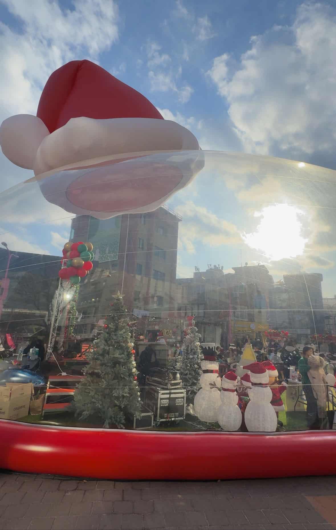 A Christmas concert in Hongdae, Seoul, set in a giant see through Santa hat