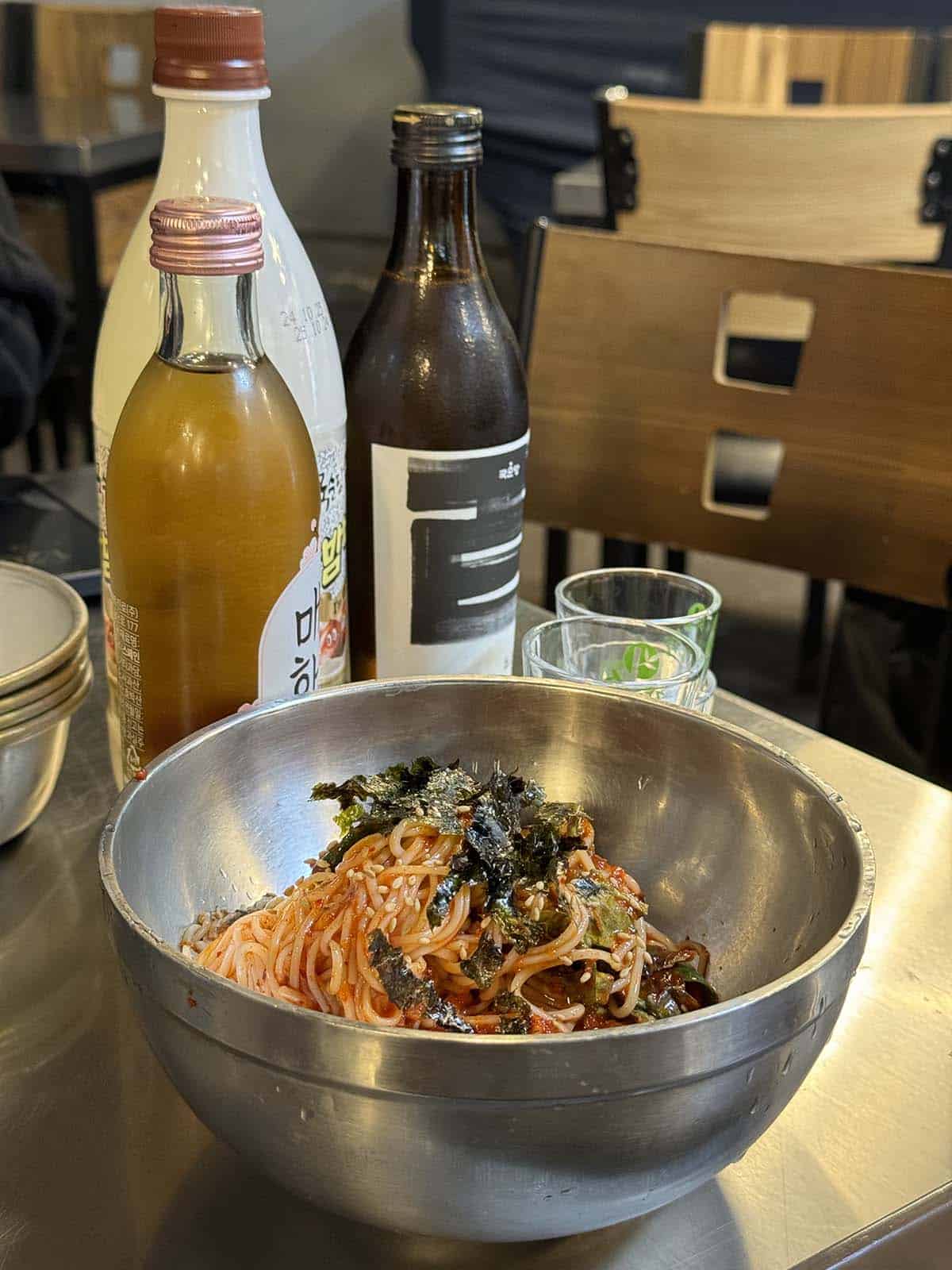A bowl of buckwheat noodles with soju and makkoli at Gwanjang market, Seoul