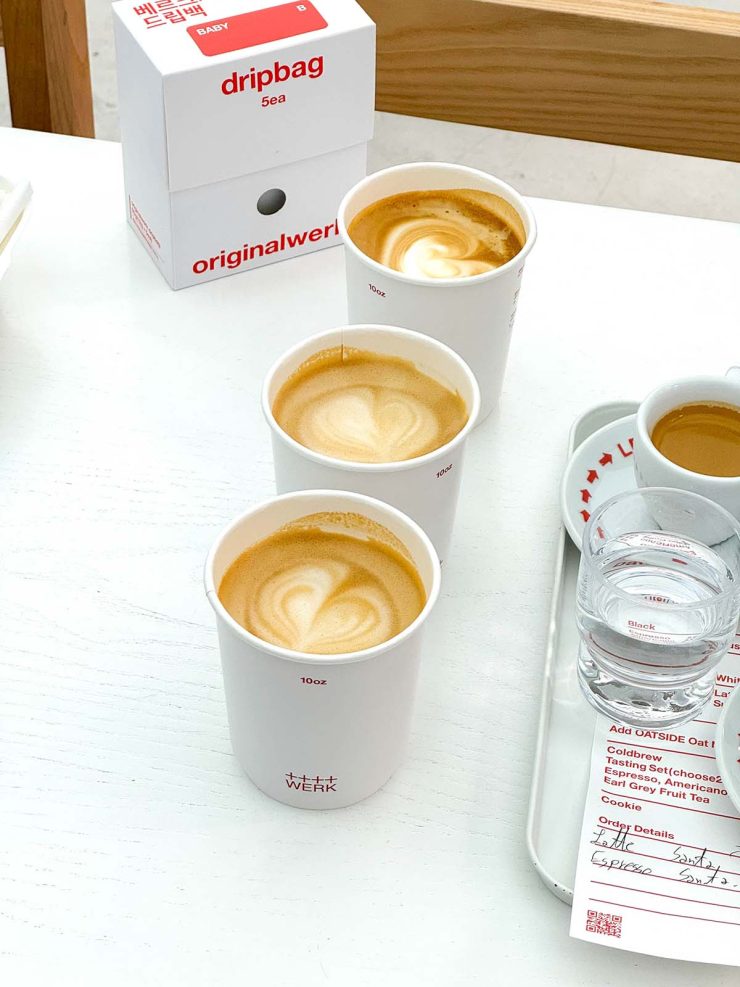 A side on view of three lattes and two espressos at Werk Coffee Roasters in Busan