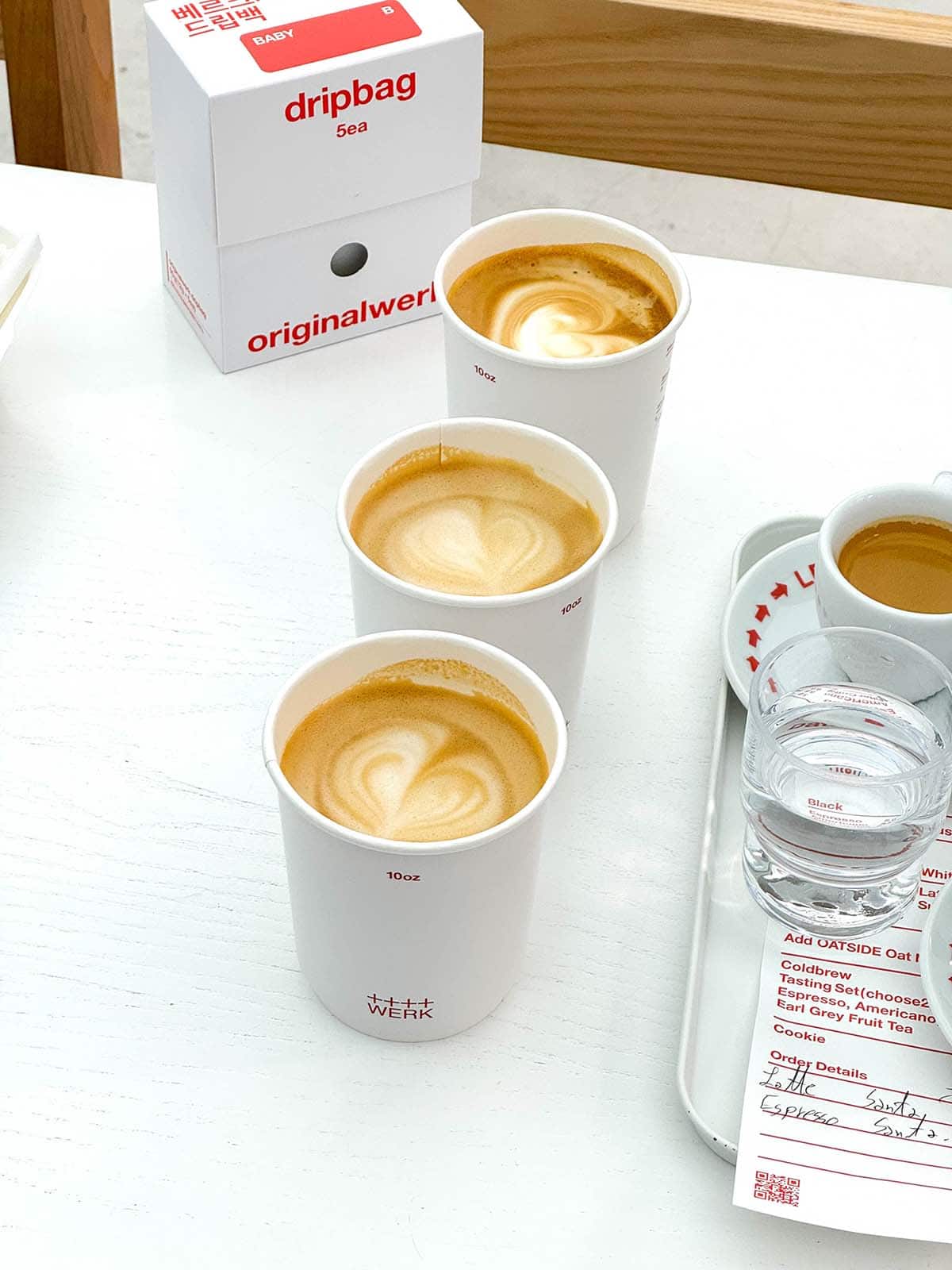 A side on view of three lattes and two espressos at Werk Coffee Roasters in Busan