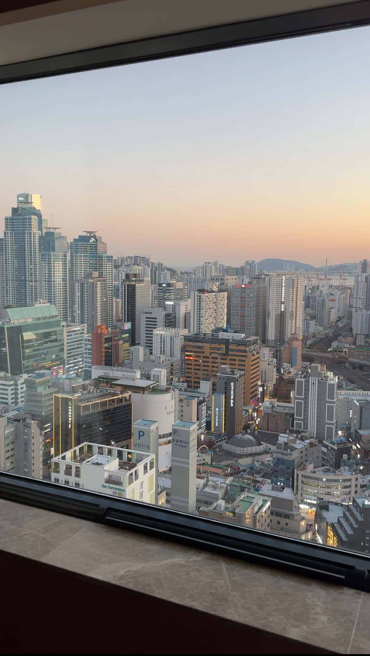 The view of Busan city as seen from the Lotte Hotel Busan at sunset