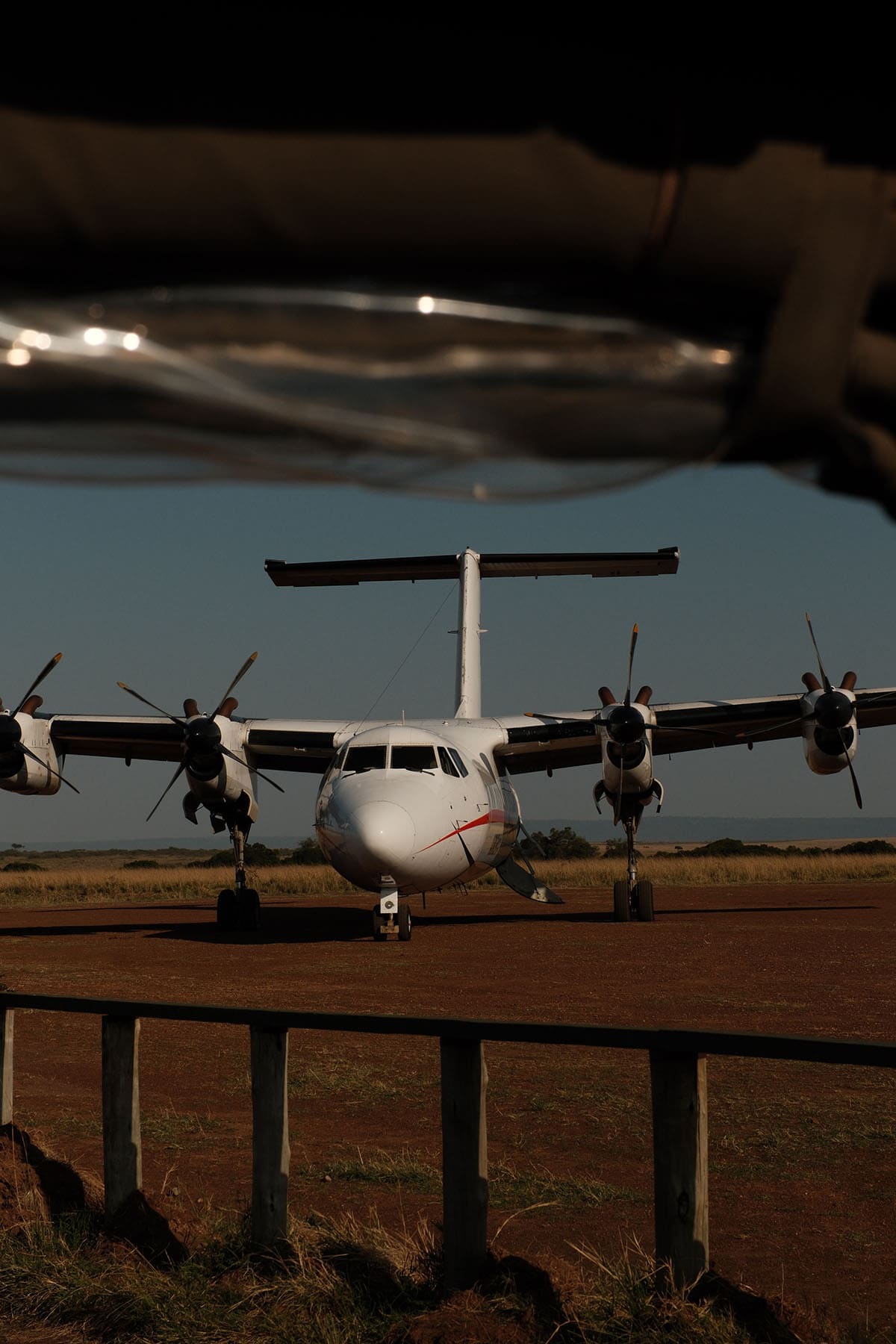 An image of a plane as seen from a Safari car at Olkimbo Airstrip in the Masai Mara, Kenya