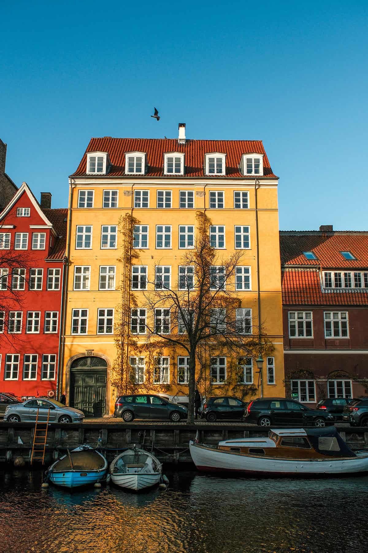 An image of the brightly coloured houses in Christianshavn, Copenhagen on a sunny winter day 