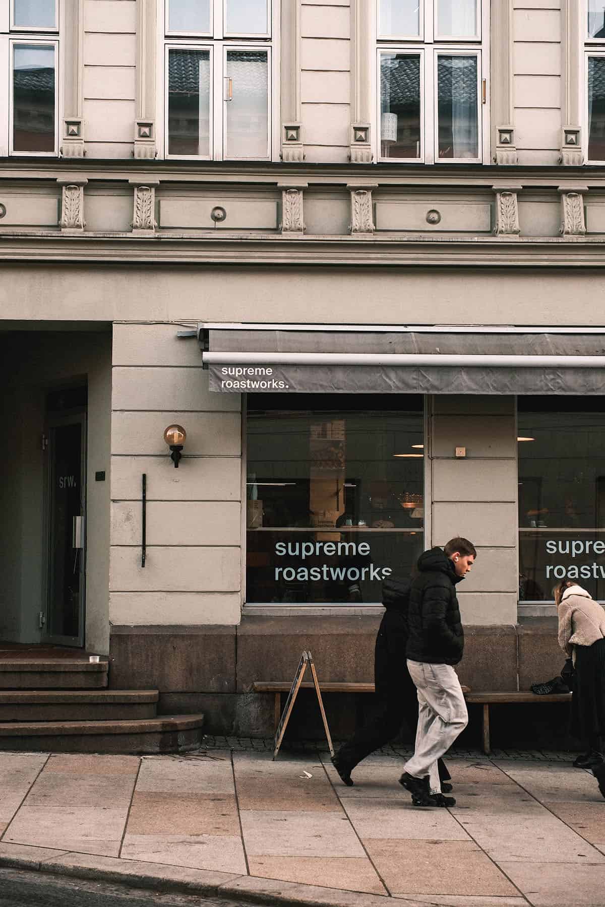 An image of people walking past Supreme Roastworks in Grünerløkka, Oslo