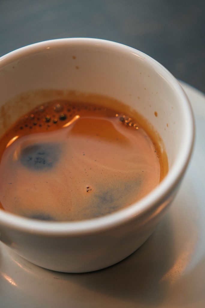 A macro image of an espresso in a white cup at Kaffemisjonen in Bergen, Norway