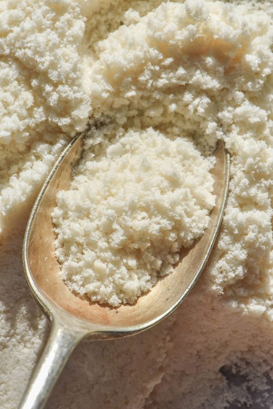 An aerial image of gluten free panko crumbs on a plate and spoon