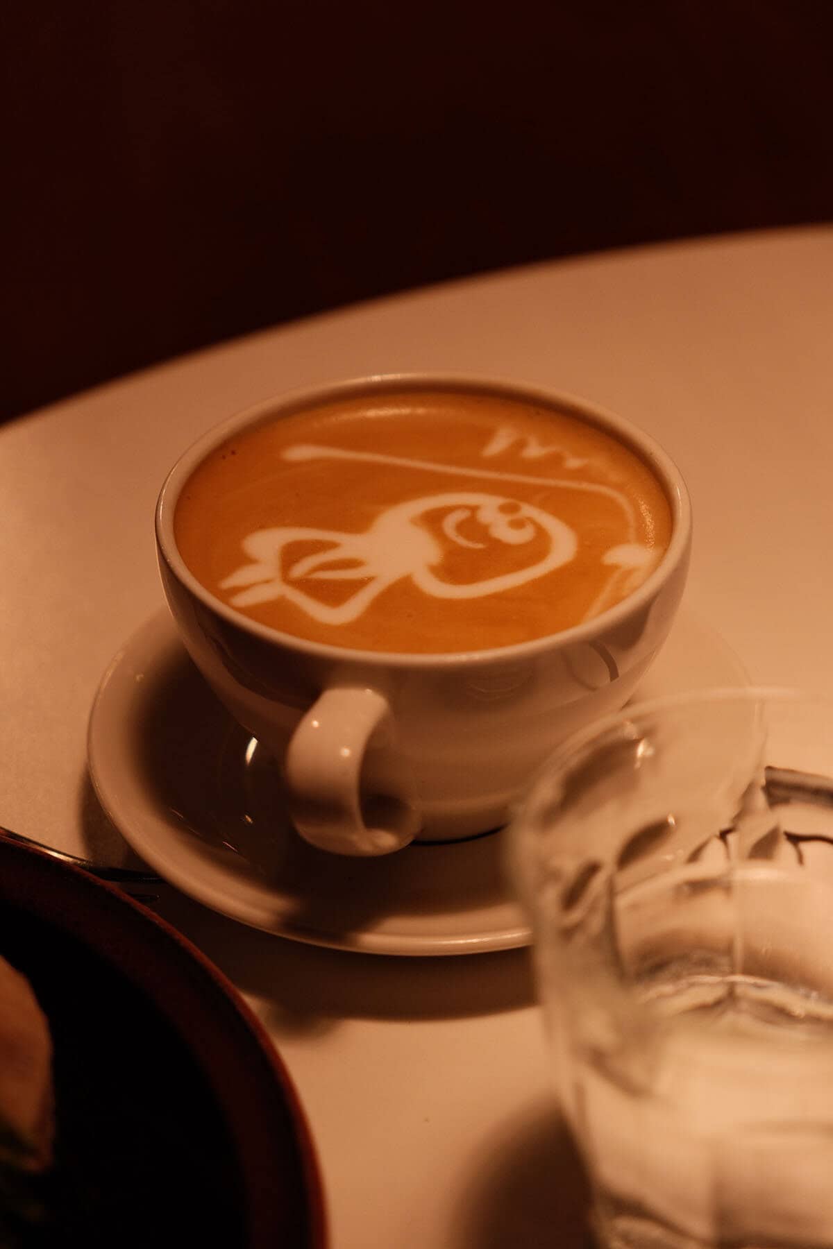 Coffee with latte art at Risø Og Mat Kaffebar in Tromsø, Norway