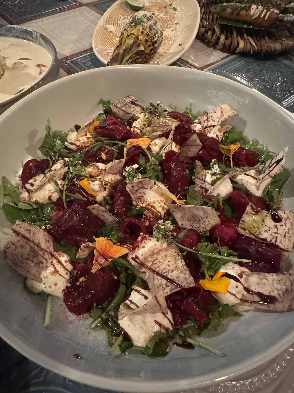 A delicious beetroot and cassava chip dish on a large serving platter at Cultiva Farm, Nairobi
