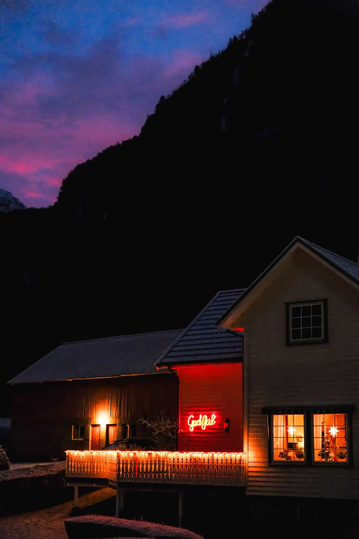 A festively decorated house at sunset on a winter day in Flåm Norway