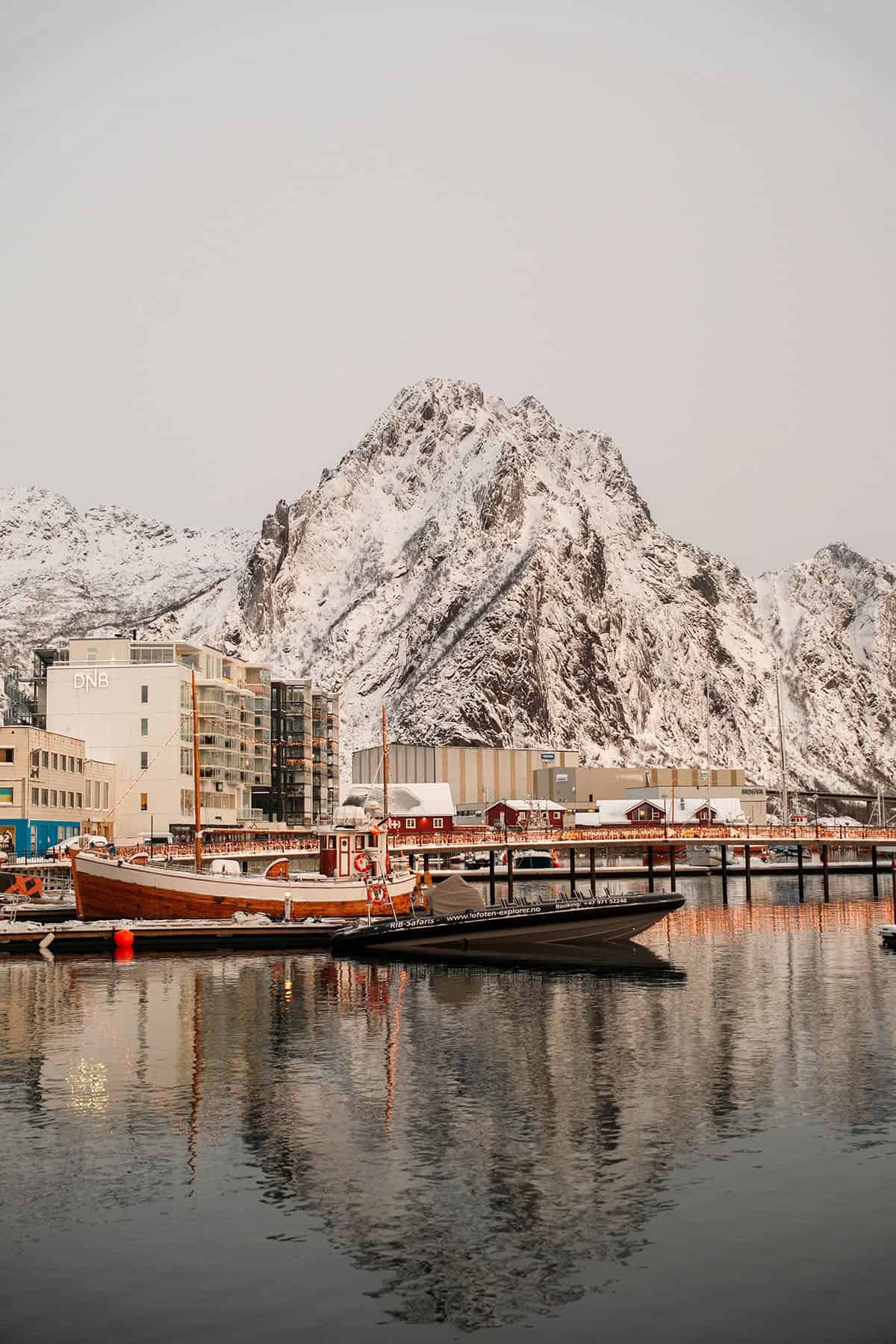 an image of Svolvær harbor in the depths of winter